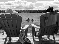 25996 c RoCrBwLe- Vacationing at the cottage - Kim, Stephanie - Julia relax on the dock while Beth - Andy boogie-board   Each New Day A Miracle  [  Understanding the Bible   |   Poetry   |   Story  ]- by Pete Rhebergen